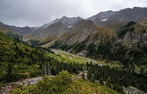Green mountain valley with river and steep mountain peaks, Chong Kyzyl Suu Valley, Terskey Ala Too,