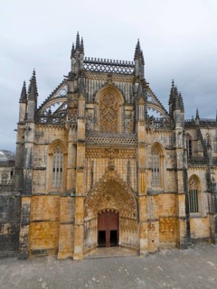 Impressive Gothic cathedral with richly decorated lancet windows and rich details on the