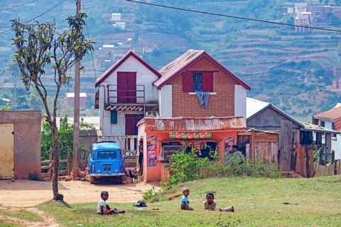 Small grocery shop and two stories brick houses in Betsileo rural village in the Ambositra