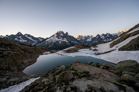 Mountain lake in the morning, mountain landscape at sunrise, water reflection in Lac Blanc,