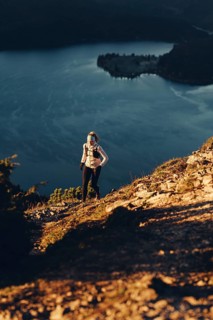 Trail running in autumn on the Jochberg on Lake Walchensee against the wonderful backdrop of the
