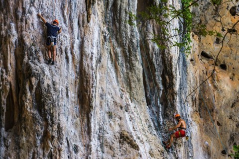 Rock climber at Phra Nang beach near Krabi, climber, outdoor, active holiday, climbing, rocks,