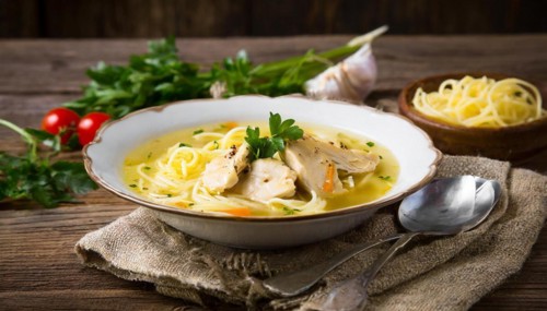 Food, a plate of chicken soup with noodles on a wooden table, AI generated, AI generated