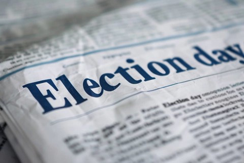 Newspaper with headline 'Election day'. Generative Ai, AI generated