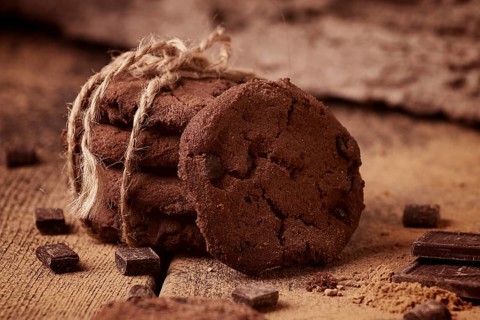 Dark chocolate cookies, with chocolate chips, on a wooden table, selective focus, close-up, no