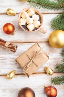 Christmas or New Year composition. Decorations, box, golden balls, cinnamon, fir and spruce