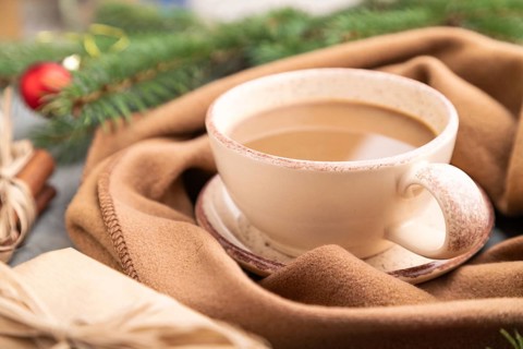 Christmas or New Year composition. Decorations, box, cinnamon, fir and spruce branches, cup of