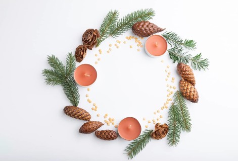 Christmas or New Year wreath composition. Decorations, cones, candles, fir and spruce branches, on