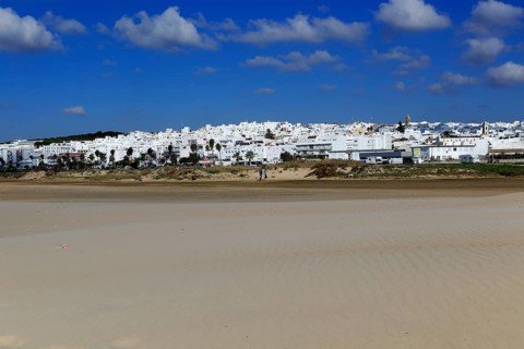Sandy beach and village of Conil de la Frontera, Cadiz Province, Spain, Europe
