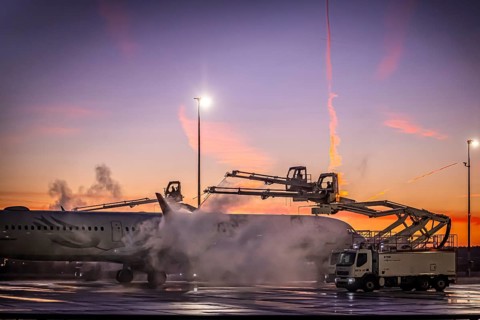 Frost at the airport, a Turkish Airlines aircraft is de-iced in front of sunrise. Airbus A321-231,