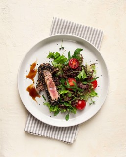 Vegetable salad, with fried tuna, in sesame seeds, healthy food, top view
