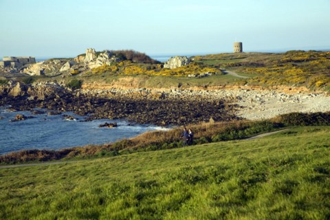 Fort le Marchant headland and loophole 'martello' tower, L'Ancresse bay Guernsey Channel Islands