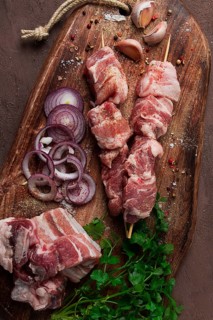 Raw pork meat, on wooden sticks, pickled kebab, with spices, top view, no people