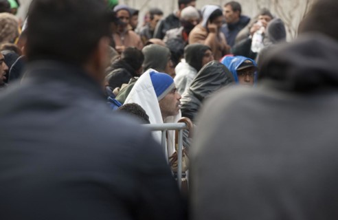 Refugees from Syria waiting to be registered at the Central Reception Centre for Asylum Seekers at