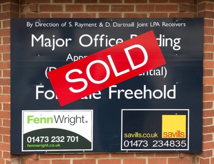 Close up of Sold estate agent sign for major office building commercial property, Ipswich, Suffolk,