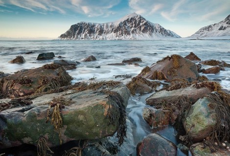 Long exposure, winter evening mood at Skagsanden, stones on the beach at Flakstad, Flakstadøy,