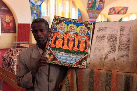 Tigray region, Axum, Aksum, St Mary's Cathedral, Maryam Tsion, inside, church servant shows old