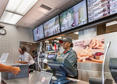 Employee taking a fast food order in a Burger King restaurant