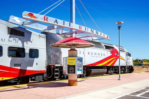 Train of the New Mexico Rail Runner Express regional railway at Zia Road station in Santa Fe, USA,