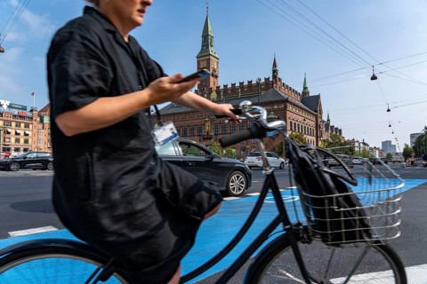Cyclists on cycle paths, Radhuspladsen, City Hall Square, in the city centre of Copenhagen,