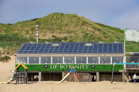 Solar modules on roofs, on the roof of a beach restaurant in Zeeland, near Koudekerke, Netherlands