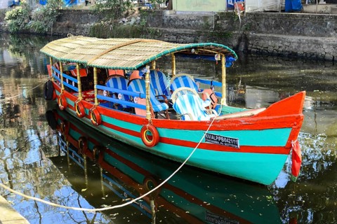 Fort Cochin, Cochin, Kerala, South India, India, Asia, Colourful traditional boat on calm canal