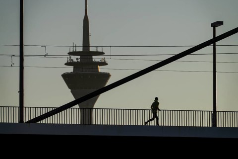 Jogger on the Oberkassler Rhine Bridge, Rhine Tower, Düsseldorf, North Rhine-Westphalia, Germany,