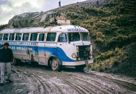 Passengers walk as Morales Mofalito's bus to La Paz slips in the mud on a difficult stretch of
