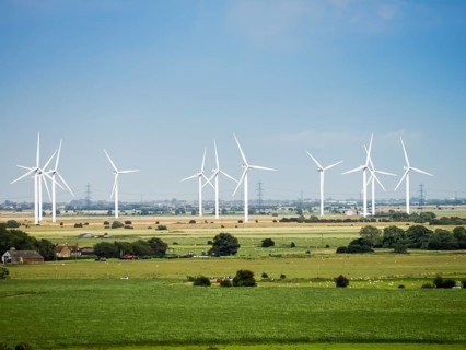 An image of some modern wind energy in the scenery