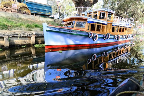 Fort Cochin, Cochin, Kerala, South India, India, Asia, Blue traditional boat reflected in the calm