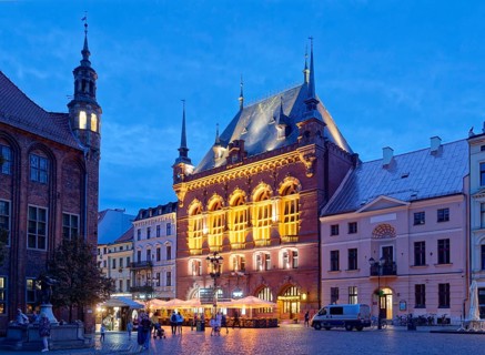 The Areszt sledczy in the medieval old town of Thorn, illuminated in the evening. The historic city