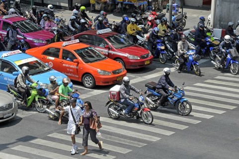 Motorbikes, mopeds and cars in traffic chaos, Ratchadamri Road, road traffic in Bangkok, Thailand,
