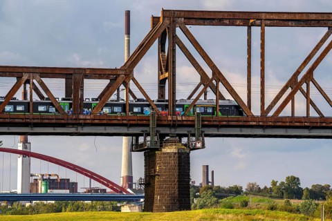 The railway bridge Duisburg-Hochfeld-Rheinhausen, over the Rhine, regional trains and many goods