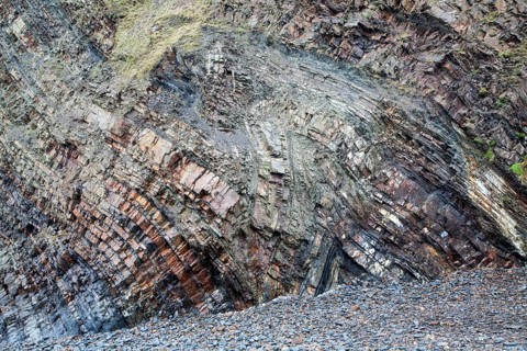 Complex folding of sedimentary rock strata in coastal cliffs at Hartland Quay, north Devon,