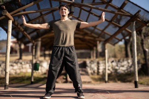 A man practices Yi Jin Jing, a Buddhist Chinese training method known as Changing Muscles and