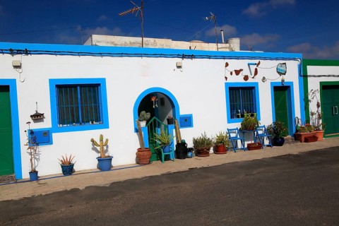 Traditional architecture pretty house painted blue and white, Las Salinas del Carmen,
