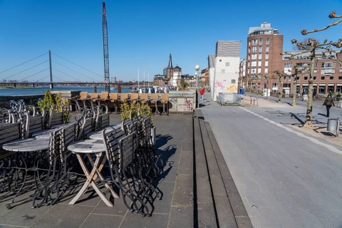 Empty Rhine embankment promenade, consequences of the contact ban, effects of the coronavirus