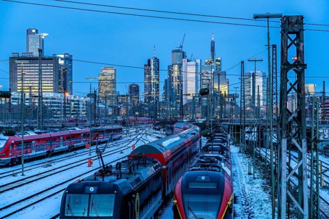 Railway tracks in front of the main railway station in Frankfurt am Main, skyline of skyscrapers in