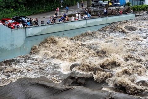 Weir of the Lake Baldeney in Essen, the masses of water roar through the open weirs, spectators,