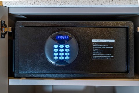Room safe in a hotel, keypad for entering a 6-digit numerical code to lock the safe for depositing