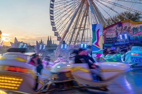 Deutz funfair on the Rhine, at Easter, funfair, break-dancer ride, Ferris wheel, Cologne Cathedral,