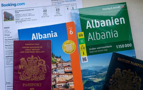 Guidebook map passports hotel booking for holiday tourist trip to Albania