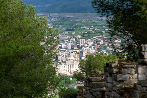 Raised view through trees over city of Berat, Albania, Europe