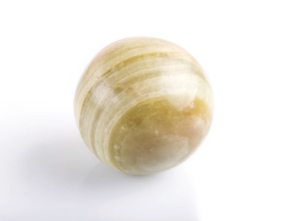 Green onyx sphere isolated on white background, close up