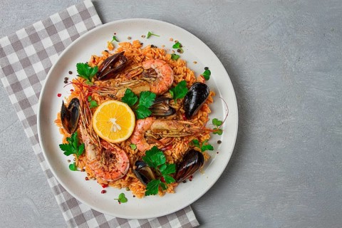 Seafood paella, shrimp and mussels risotto, rice, homemade, top view, no people