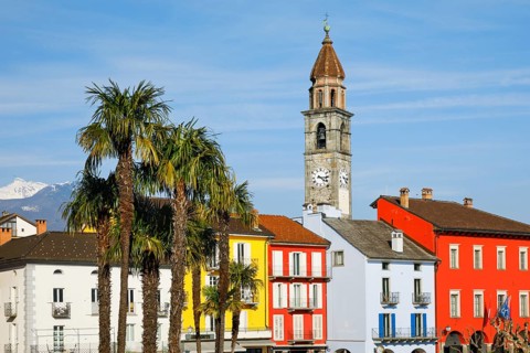 Colourful house facades on the lakeside promenade of Ascona on Lake Maggiore, Canton Ticino,