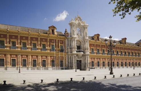 San Telmo palace building facade with columns at the entrance decorated with carved statues and