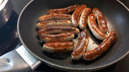 Freshly roasted Nuremberg sausages in a pan, Bavaria, Germany, Europe