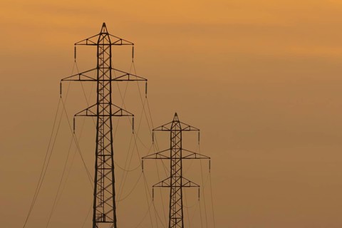 Electricity pylons silhouette at sunset, Kent, England, United Kingdom, Europe