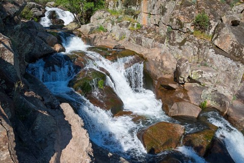 Thundering waterfall over rocks in a quiet forest, clear flowing water, Cascada del Diablo, Devil's